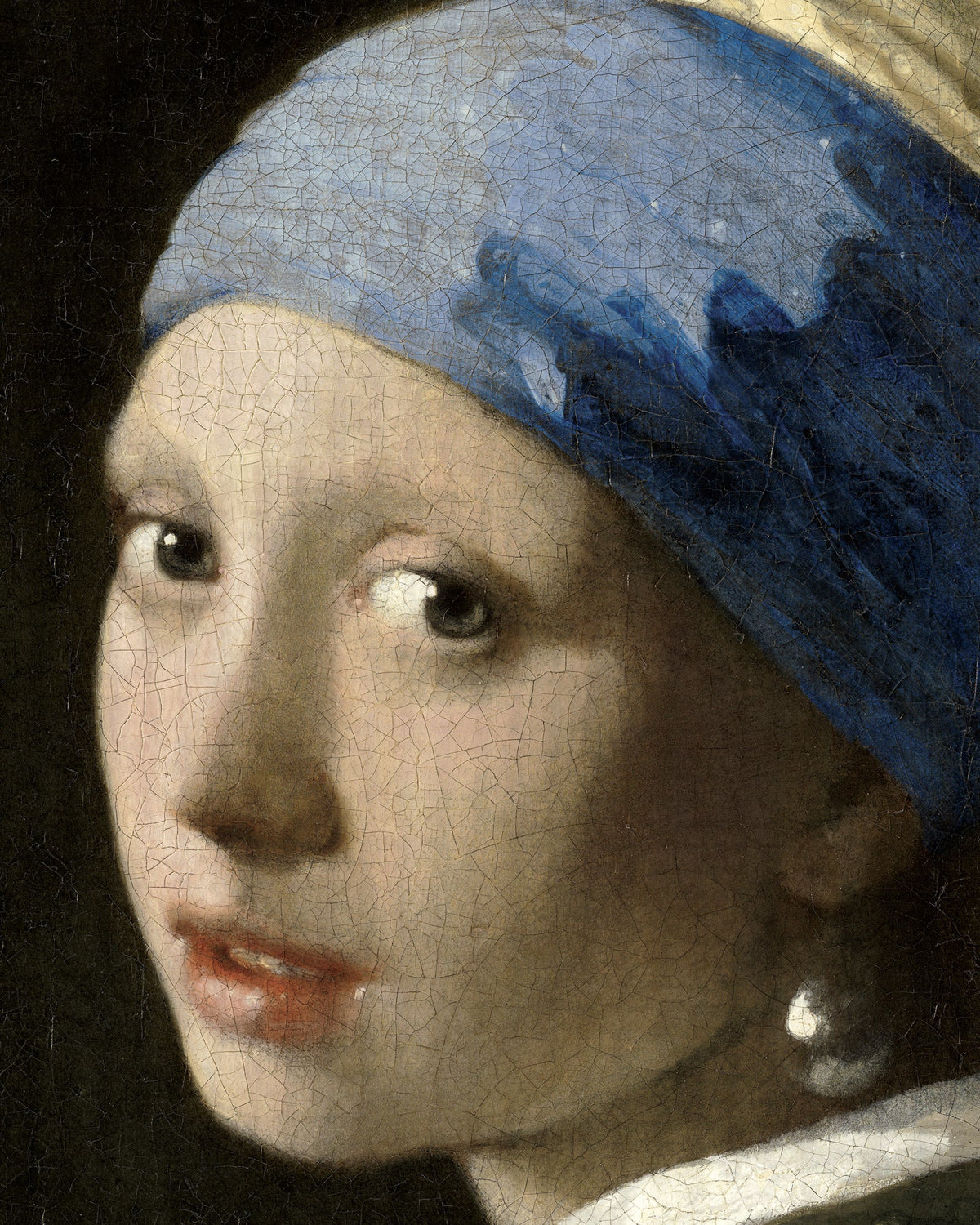 Close-up of Vermeer's Girl with a Pearl Earring showing her eyes, parted lips, blue turban and pearl